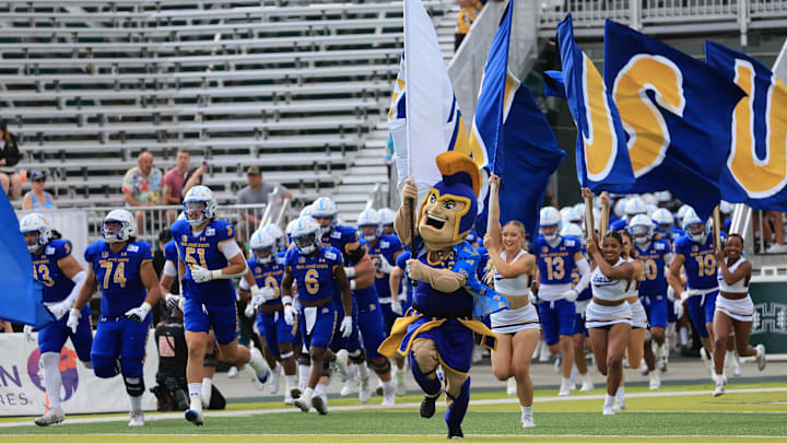 The San Jose State Spartans run out at the start of the Hawaii Bowl 