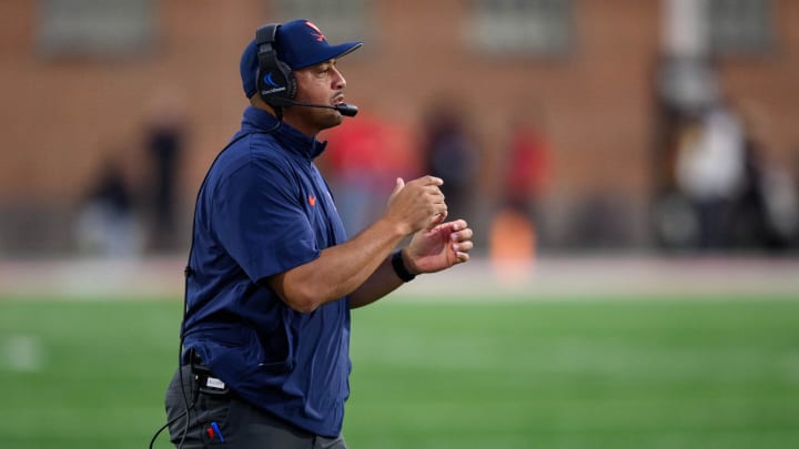 Tony Elliott directs his team during the Virginia football game against Maryland at SECU Stadium.