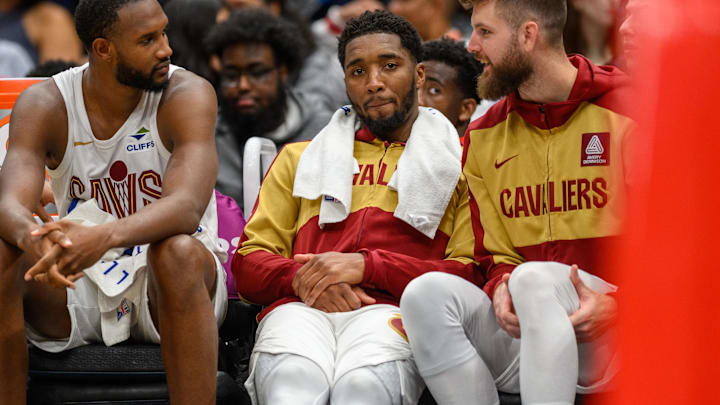 Oct 26, 2024; Washington, District of Columbia, USA; Cleveland Cavaliers guard Donovan Mitchell (45) reacts on the bench with forward Evan Mobley (4) during the fourth quarter against the Washington Wizardsat Capital One Arena. Mandatory Credit: Reggie Hildred-Imagn Images
