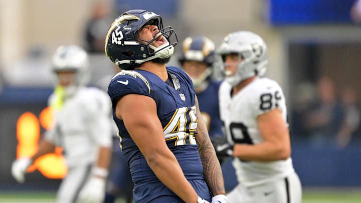 Nov 30, 2025; Inglewood, California, USA; Los Angeles Chargers linebacker Tuli Tuipulotu (45) reacts after a sack against the Las Vegas Raiders during the second half at SoFi Stadium. Mandatory Credit: Jayne Kamin-Oncea-Imagn Images