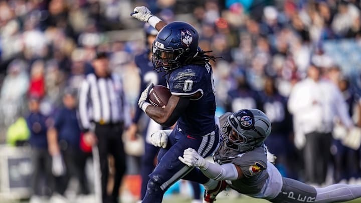 Nov 15, 2025; East Hartford, Connecticut, USA; UConn Huskies running back Cam Edwards (0) runs the ball against the Air Force Falcons in the second half at Pratt & Whitney Stadium at Rentschler Field. Mandatory Credit: David Butler II-Imagn Images