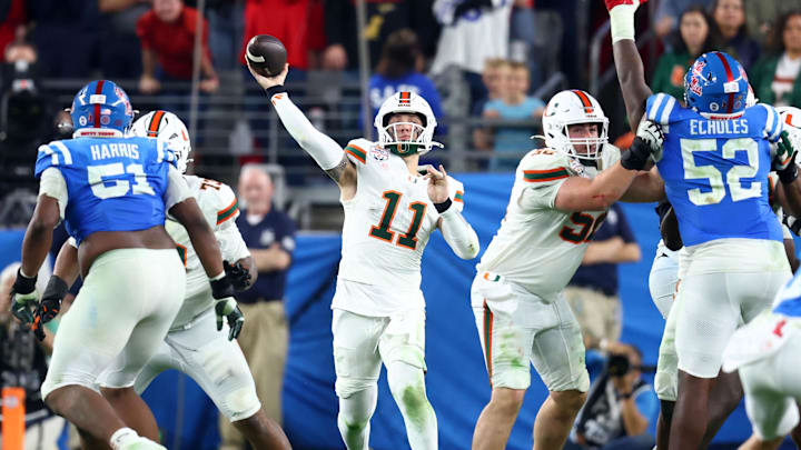 Jan 8, 2026; Glendale, AZ, USA; Miami Hurricanes quarterback Carson Beck (11) drops back to pass against the Mississippi Rebels in the second half during the 2026 Fiesta Bowl and semifinal game of the College Football Playoff at State Farm Stadium. Mandatory Credit: Mark J. Rebilas-Imagn Images
