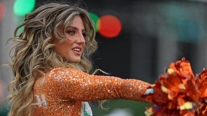 A Miami Hurricanes cheerleader performs before the College Football Playoff National Championship game at Hard Rock Stadium.