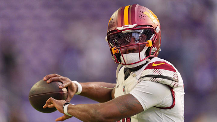 Dec 7, 2025; Minneapolis, Minnesota, USA; Washington Commanders quarterback Josh Johnson (14) practices before the game at U.S. Bank Stadium. Mandatory Credit: Brad Rempel-Imagn Images