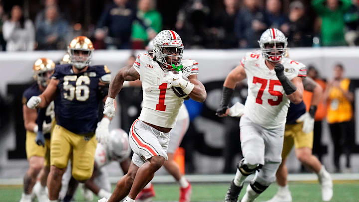 Ohio State Buckeyes running back Quinshon Judkins gets away from the Notre Dame Fighting Irish defense