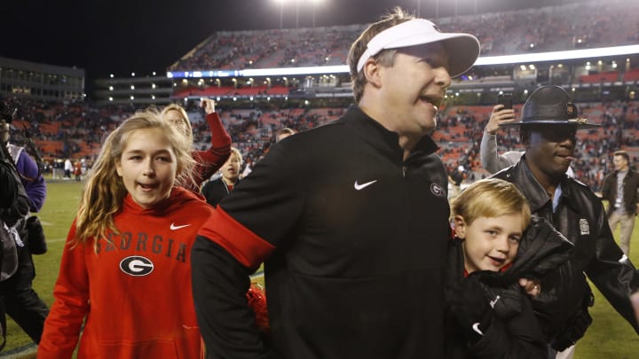 Nov 16, 2019; Auburn, AL, USA; Georgia Bulldogs head coach Kirby Smart celebrates with daughter, Julia, and son, Andrew, after beating the Auburn Tigers at Jordan-Hare Stadium. Mandatory Credit: John Reed-USA TODAY Sports