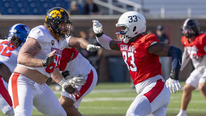 Jan 29, 2026; Mobile, AL, USA; National offensive lineman Gennings Dunker (68) of Iowa works against National defensive end Dani Dennis-Sutton (33) of Penn State during National Senior Bowl practice at Hancock Whitney Stadium. Mandatory Credit: Vasha Hunt-Imagn Images