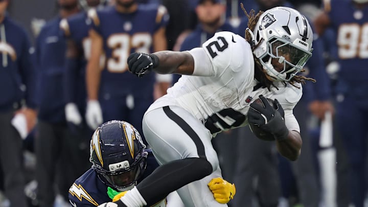 Las Vegas Raiders running back Ashton Jeanty (2) rushes the ball past Los Angeles Chargers cornerback Tarheeb Still (29) during the second half at SoFi Stadium. Las Vegas Raiders running back Ashton Jeanty (2) rushes the ball past Los Angeles Chargers cornerback Tarheeb Still (29) during the second half at SoFi Stadium.