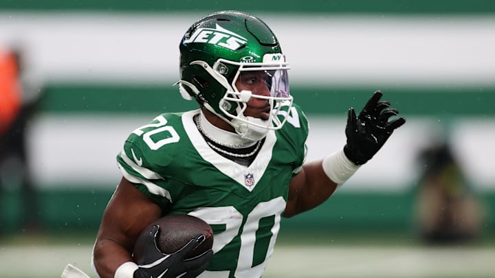 Nov 30, 2025; East Rutherford, New Jersey, USA; New York Jets running back Breece Hall (20) rushes the ball against the Atlanta Falcons during the first half at MetLife Stadium. Nov 30, 2025; East Rutherford, New Jersey, USA; New York Jets running back Breece Hall (20) rushes the ball against the Atlanta Falcons during the first half at MetLife Stadium.