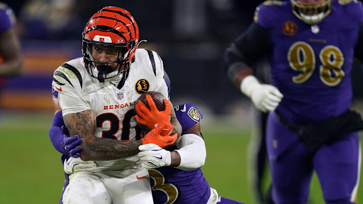 Cincinnati Bengals running back Chase Brown (30) rushed the ball against Baltimore Ravens cornerback Chidobe Awuzie (3) during the second half at M&T Bank Stadium. 