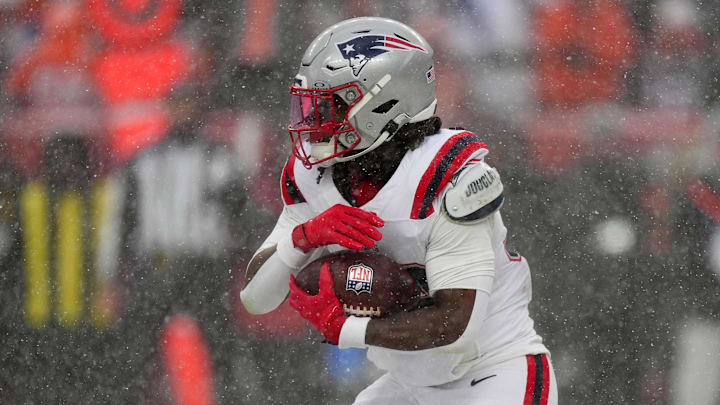 Jan 25, 2026; Denver, CO, USA; New England Patriots running back Rhamondre Stevenson (38) rushes the ball against the Denver Broncos during the second half in the 2026 AFC Championship Game at Empower Field at Mile High. 