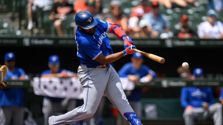 Toronto Blue Jays first baseman Vladimir Guerrero Jr. (27) hits a single against the Baltimore Orioles during the first inning at Oriole Park at Camden Yards in 2024.