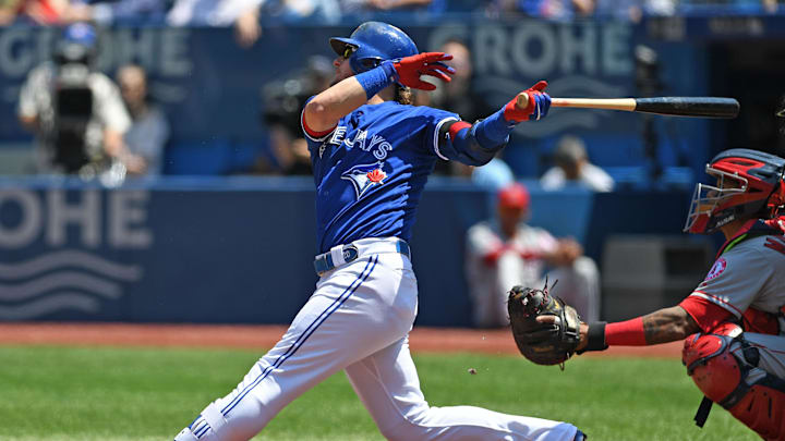 Toronto Blue Jays third base Josh Donaldson (20) hits a single during the regular season MLB game between the Los Angeles Angels and Toronto Blue Jays at Rogers Centre in 2018.