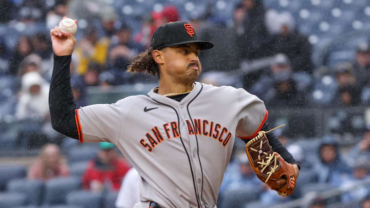 Apr 12, 2025; Bronx, New York, USA; San Francisco Giants pitcher Jordan Hicks (12) delivers a pitch against the New York Yankees during the first inning at Yankee Stadium. 