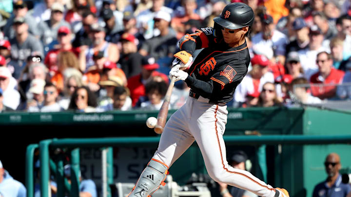 May 24, 2025; Washington, District of Columbia, USA; San Francisco Giants outfielder Jung Hoo Lee (51) hits a single during the fourth inning against the Washington Nationals at Nationals Park. 