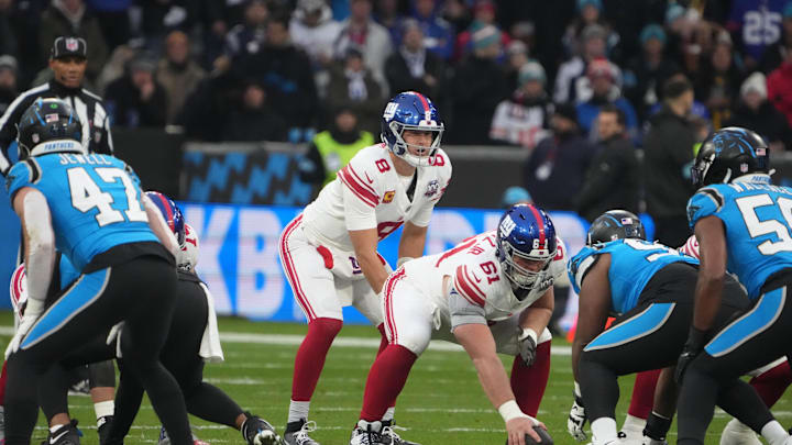 Nov 10, 2024; Munich, Germany; New York Giants quarterback Daniel Jones (8) takes the snap from center John Michael Schmitz Jr. (61) in the first half during the 2024 NFL Munich Game at Allianz Arena. Nov 10, 2024; Munich, Germany; New York Giants quarterback Daniel Jones (8) takes the snap from center John Michael Schmitz Jr. (61) in the first half during the 2024 NFL Munich Game at Allianz Arena.