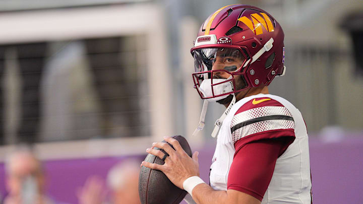Dec 7, 2025; Minneapolis, Minnesota, USA; Washington Commanders quarterback Marcus Mariota (8) practices before the game at U.S. Bank Stadium.  