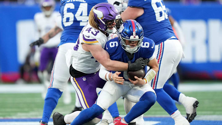 Dec 21, 2025; East Rutherford, New Jersey, USA; Minnesota Vikings outside linebacker Andrew van Ginkel (43) sacks New York Giants quarterback Jaxson Dart (6) during the second half at MetLife Stadium.  