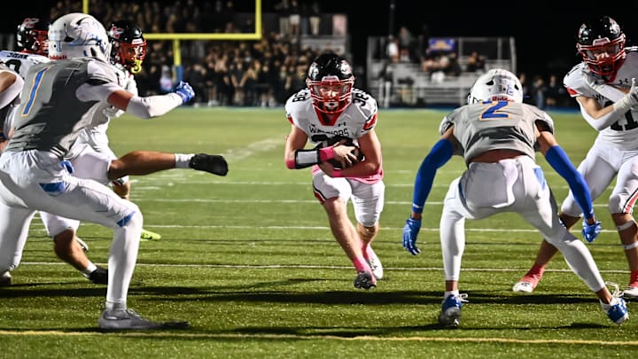 Muskego fullback Bryson Hoeffler (38) finds a hole in the against Mukwonago defense to score a touchdown during the first quarter in a game Friday, October 17, 2025, at Mukwonago High School in Mukwonago, Wisconsin.