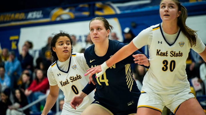Kent State University’s Caitlyn Holmes (0), University of Akron’s Liisa Taponen (14), and Kent State University’s Riley Rismiller (30) during a Kent free throw, Jan. 17, 2026, at M.A.C. Center in Kent, Ohio. Kent State University’s Caitlyn Holmes (0), University of Akron’s Liisa Taponen (14), and Kent State University’s Riley Rismiller (30) during a Kent free throw, Jan. 17, 2026, at M.A.C. Center in Kent, Ohio.