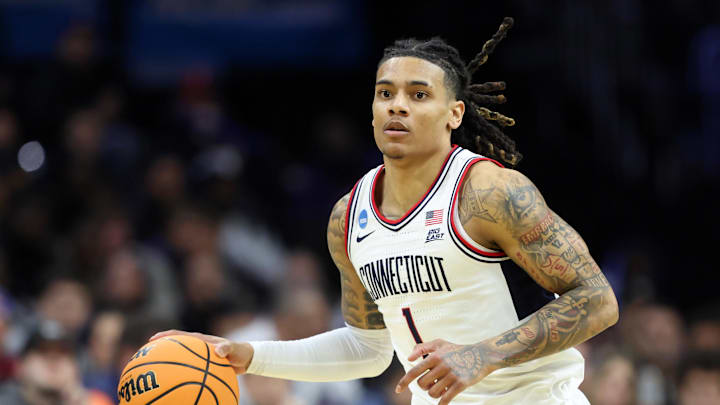 Mar 20, 2026; Philadelphia, PA, USA; UConn Huskies guard Solo Ball (1) dribbles the ball against the Furman Paladins in the first half during a first round game of the men's 2026 NCAA Tournament at Xfinity Mobile Arena. Mandatory Credit: Bill Streicher-Imagn Images