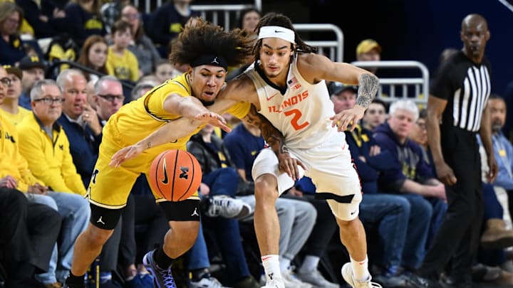 Mar 2, 2025; Ann Arbor, Michigan, USA; Michigan Wolverines guard Tre Donaldson (3) battles Illinois Fighting Illini guard Dra Gibbs-Lawhorn (2) for a loose ball in the first half at Crisler Center. Mandatory Credit: Lon Horwedel-Imagn Images