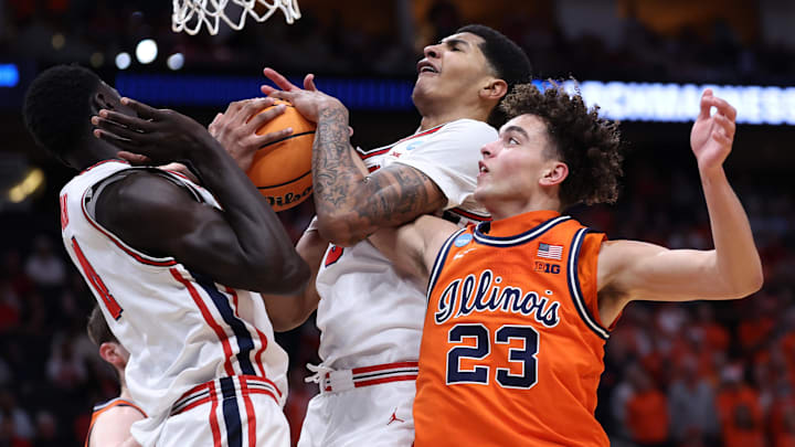 Mar 26, 2026; Houston, TX, USA; Houston Cougars center Chris Cenac Jr. (5) grabs a rebound against Illinois Fighting Illini guard Keaton Wagler (23) in the first half during a Sweet Sixteen game of the South Regional of the men's 2026 NCAA Tournament at Toyota Center. Mandatory Credit: Troy Taormina-Imagn Images