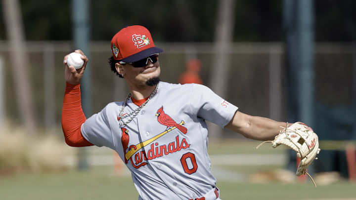 Feb 16, 2026; Jupiter, FL, USA; St. Louis Cardinals shortstop Masyn Winn (0) throws during spring training workouts at Roger Dean Stadium. Mandatory Credit: Reinhold Matay-Imagn Images