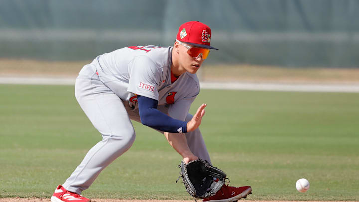 Feb 16, 2026; Jupiter, FL, USA;  St. Louis Cardinals infielder JJ Wetherholt (77) fields the ball during spring training workouts at Roger Dean Stadium. Mandatory Credit: Reinhold Matay-Imagn Images