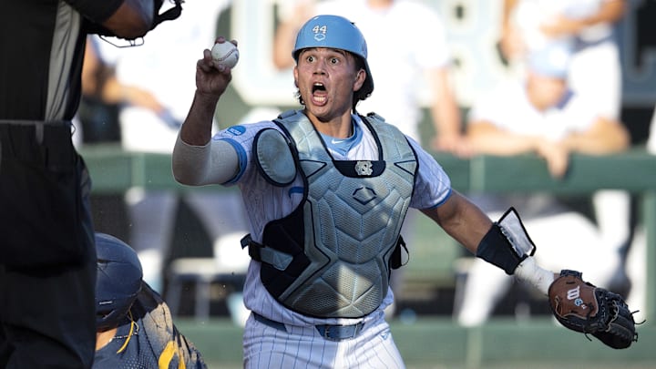 Jun 7, 2024; Chapel Hill, NC, USA; North Carolina Tar Heels Luke Stevenson (44) argues with the umpire after a play at the plate against the West Virginia Mountaineers in the fifth inning of the DI Baseball Super Regional at Boshamer Stadium.