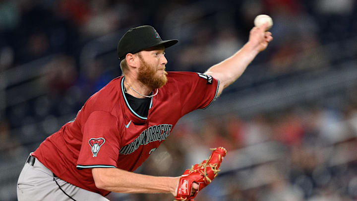 Apr 4, 2025; Washington, District of Columbia, USA; Arizona Diamondbacks pitcher A.J. Puk (33) throws a pitch during the eighth inning against the Washington Nationals at Nationals Park. Mandatory Credit: Reggie Hildred-Imagn Images