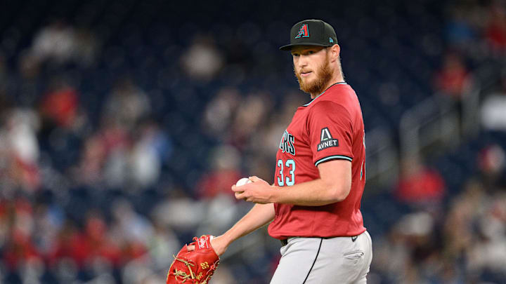 Apr 4, 2025; Washington, District of Columbia, USA; Arizona Diamondbacks pitcher A.J. Puk (33) looks on during the eighth inning against the Washington Nationals at Nationals Park. Mandatory Credit: Reggie Hildred-Imagn Images