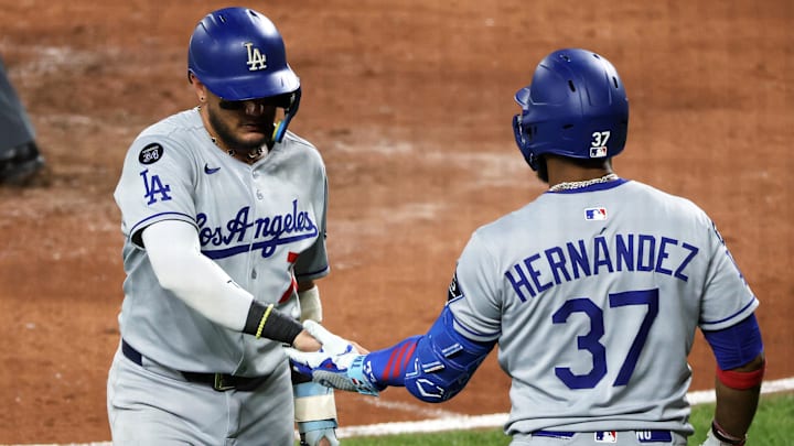 Sep 6, 2025; Baltimore, Maryland, USA; Los Angeles Dodgers second baseman Miguel Rojas (72) celebrates with Los Angeles Dodgers outfielder Teoscar Hernandez (37) after scoring a run during the fifth inning against the Baltimore Orioles at Oriole Park at Camden Yards. Mandatory Credit: Daniel Kucin Jr.-Imagn Images Sep 6, 2025; Baltimore, Maryland, USA; Los Angeles Dodgers second baseman Miguel Rojas (72) celebrates with Los Angeles Dodgers outfielder Teoscar Hernandez (37) after scoring a run during the fifth inning against the Baltimore Orioles at Oriole Park at Camden Yards. Mandatory Credit: Daniel Kucin Jr.-Imagn Images