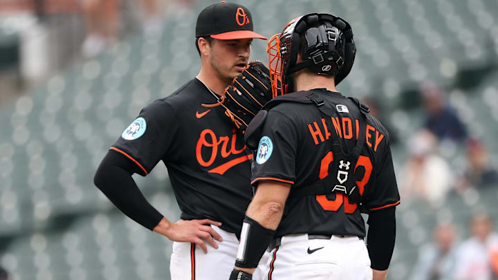 May 14, 2025; Baltimore, Maryland, USA; Baltimore Orioles pitcher Chayce McDermott (59) speaks with Baltimore Orioles catcher Maverick Handley (98) during the first inning against the Minnesota Twins at Oriole Park at Camden Yards. Mandatory Credit: Daniel Kucin Jr.-Imagn Images