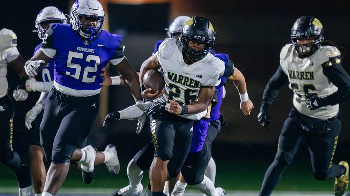 Warren Central High School senior Keyon Thomas (26) runs the ball out of the backfield during the first half of an IHSAA Class 6A semi-state football game against Brownsburg High School, Friday, Nov. 21, 2025, at Brownsburg High School. Warren Central High School senior Keyon Thomas (26) runs the ball out of the backfield during the first half of an IHSAA Class 6A semi-state football game against Brownsburg High School, Friday, Nov. 21, 2025, at Brownsburg High School.