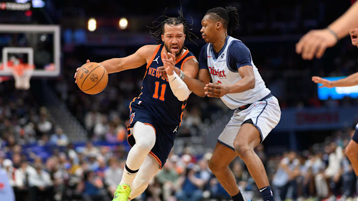 Dec 30, 2024; Washington, District of Columbia, USA; New York Knicks guard Jalen Brunson (11) handles the ball against Washington Wizards guard Carlton Carrington (8) during the second quarter at Capital One Arena. Mandatory Credit: Reggie Hildred-Imagn Images Dec 30, 2024; Washington, District of Columbia, USA; New York Knicks guard Jalen Brunson (11) handles the ball against Washington Wizards guard Carlton Carrington (8) during the second quarter at Capital One Arena. Mandatory Credit: Reggie Hildred-Imagn Images
