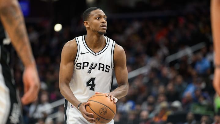 Feb 10, 2025; Washington, District of Columbia, USA; San Antonio Spurs guard De'Aaron Fox (4) shoots a free throw during the third quarter against the Washington Wizards at Capital One Arena. Mandatory Credit: Reggie Hildred-Imagn Images