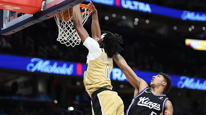 Feb 1, 2026; Washington, District of Columbia, USA; Washington Wizards guard Bilal Coulibaly (0) dunks over Sacramento Kings guard Nique Clifford (5) during the first half at Capital One Arena. Mandatory Credit: Daniel Kucin Jr.-Imagn Images