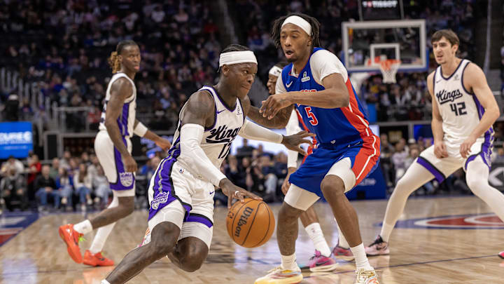 Jan 25, 2026; Detroit, Michigan, USA; Detroit Pistons forward Ronald Holland II (5) defends against Sacramento Kings guard Dennis Schroder (17) during the first half at Little Caesars Arena. Mandatory Credit: David Reginek-Imagn Images