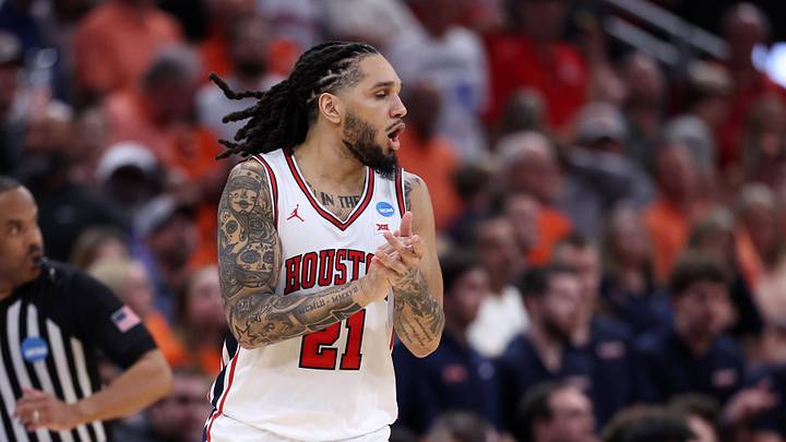 Mar 26, 2026; Houston, TX, USA; Houston Cougars guard Emanuel Sharp (21) reacts in the first half during a Sweet Sixteen game of the South Regional of the men's 2026 NCAA Tournament at Toyota Center. Mandatory Credit: Troy Taormina-Imagn Images