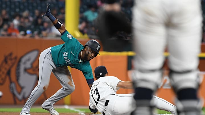 Seattle Mariners center fielder Victor Robles (10) slides safely into third base around the tag of Detroit Tigers third baseman Gio Urshela (13) in the eighth inning at Comerica Park on Aug 14. Seattle Mariners center fielder Victor Robles (10) slides safely into third base around the tag of Detroit Tigers third baseman Gio Urshela (13) in the eighth inning at Comerica Park on Aug 14.
