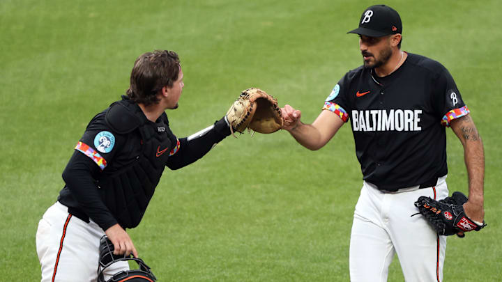 Baltimore Orioles pitcher Zach Eflin (24) and Baltimore Orioles catcher Adley Rutschman (35) celebrate during the seventh inning against the Chicago White Sox at Oriole Park at Camden Yards on May 30. Baltimore Orioles pitcher Zach Eflin (24) and Baltimore Orioles catcher Adley Rutschman (35) celebrate during the seventh inning against the Chicago White Sox at Oriole Park at Camden Yards on May 30.
