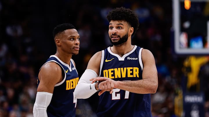 Oct 26, 2024; Denver, Colorado, USA; Denver Nuggets guard Jamal Murray (27) gestures ahead of guard Russell Westbrook (4) in the fourth quarter against the Los Angeles Clippers at Ball Arena. Mandatory Credit: Isaiah J. Downing-Imagn Images