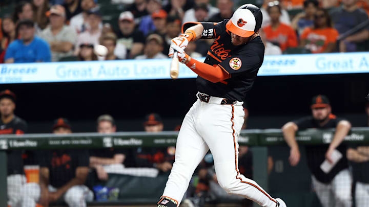 Jun 11, 2025; Baltimore, Maryland, USA; Baltimore Orioles outfielder Ryan O'Hearn (32) hits an RBI single during the eighth inning against the Detroit Tigers at Oriole Park at Camden Yards.