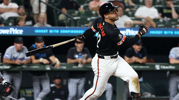 Jul 11, 2025; Baltimore, Maryland, USA; Baltimore Orioles designated hitter Ramon Laureano (12) hits an RBI single during the seventh inning against the Miami Marlins at Oriole Park at Camden Yards.