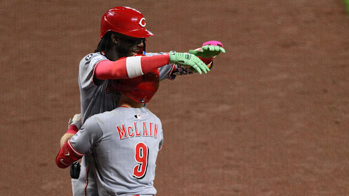 Apr 18, 2025; Baltimore, Maryland, USA; Cincinnati Reds second baseman Matt McLain (9) celebrates with shortstop Elly De La Cruz (44) after scoring in the fourth inning against the Baltimore Orioles at Oriole Park at Camden Yards. Mandatory Credit: Reggie Hildred-Imagn Images