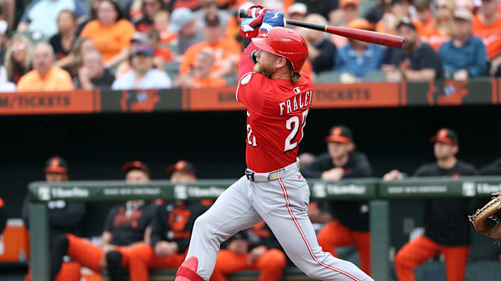 Apr 19, 2025; Baltimore, Maryland, USA; Cincinnati Reds outfielder Jake Fraley (27) hits a home run during the second inning against the Baltimore Orioles at Oriole Park at Camden Yards. Mandatory Credit: Daniel Kucin Jr.-Imagn Images