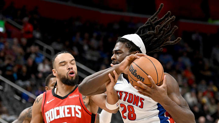 Nov 10, 2024; Detroit, Michigan, USA;  Detroit Pistons center Isaiah Stewart (28) grabs a rebound away from Houston Rockets forward Dillon Brooks (9) in the first quarter at Little Caesars Arena. Mandatory Credit: Lon Horwedel-Imagn Images