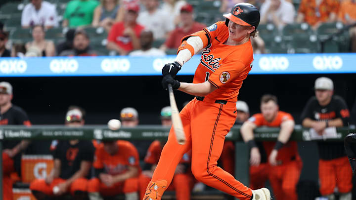 May 17, 2025; Baltimore, Maryland, USA; Baltimore Orioles outfielder Heston Kjerstad (13) hits a single during the ninth inning against the Washington Nationals at Oriole Park at Camden Yards. Mandatory Credit: Daniel Kucin Jr.-Imagn Images