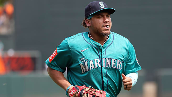 Aug 14, 2025; Baltimore, Maryland, USA; Seattle Mariners first baseman Josh Naylor (12) looks on before a game against the Baltimore Orioles at Oriole Park at Camden Yards. Mandatory Credit: Daniel Kucin Jr.-Imagn Images